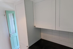 Howdens Witney matt white units in a utility room
