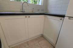 Howdens Witney matt white units in a utility room