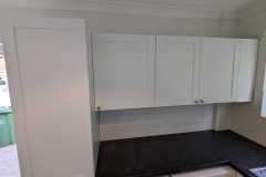 Howdens Witney matt white units in a utility room