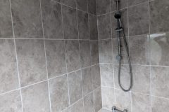 New bathtub and wall tiles after leak identified and fixed